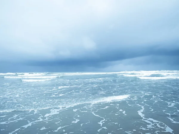 storm over the ocean with wave and beach