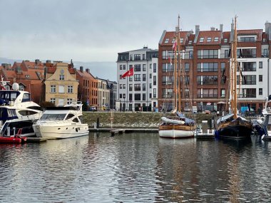 Gdansk Poland January 7, 2022. Old Town, historic buildings on the Motlawa River, visible Marina - yachts and motorboats clipart