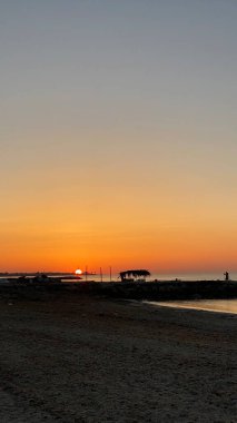 empty beaches at sunrise orange sky calm can