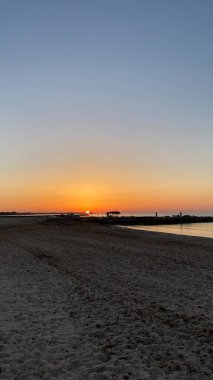 empty beaches at sunrise orange sky calm can
