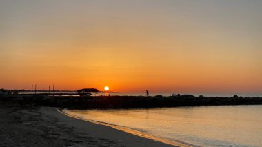 empty beaches at sunrise orange sky calm can