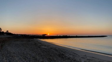 empty beaches at sunrise orange sky calm can