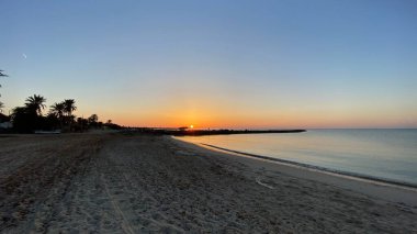 empty beaches at sunrise orange sky calm can