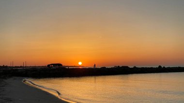 empty beaches at sunrise orange sky calm can