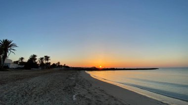 empty beaches at sunrise orange sky calm can