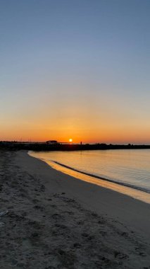 empty beaches at sunrise orange sky calm can