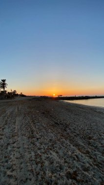 empty beaches at sunrise orange sky calm can