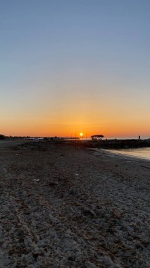 empty beaches at sunrise orange sky calm can
