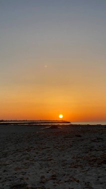 empty beaches at sunrise orange sky calm can