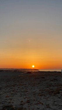 empty beaches at sunrise orange sky calm can