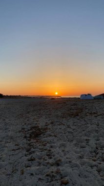 empty beaches at sunrise orange sky calm can