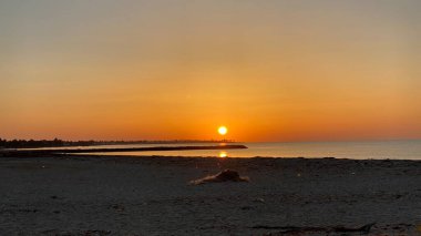 empty beaches at sunrise orange sky calm can
