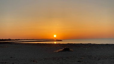 empty beaches at sunrise orange sky calm can