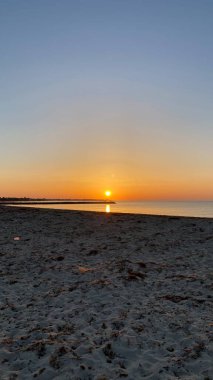empty beaches at sunrise orange sky calm can