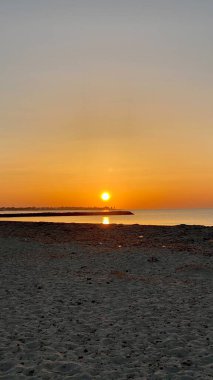 empty beaches at sunrise orange sky calm can