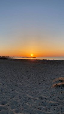 empty beaches at sunrise orange sky calm can
