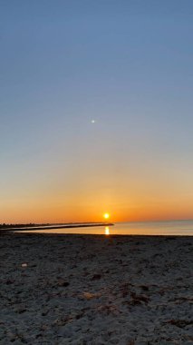 empty beaches at sunrise orange sky calm can
