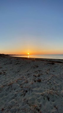 empty beaches at sunrise orange sky calm can