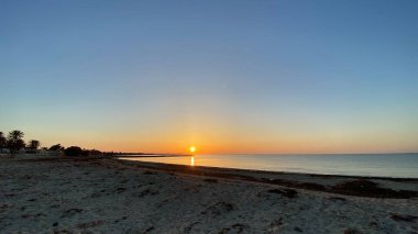 empty beaches at sunrise orange sky calm can