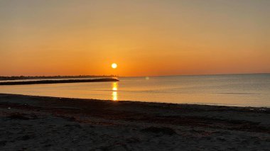 empty beaches at sunrise orange sky calm can