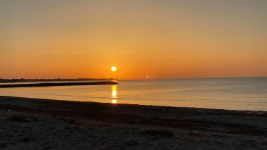 empty beaches at sunrise orange sky calm can