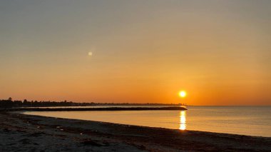 empty beaches at sunrise orange sky calm can