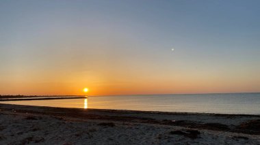 empty beaches at sunrise orange sky calm can