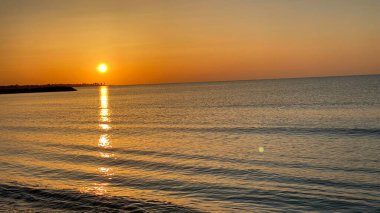 empty beaches at sunrise orange sky calm can