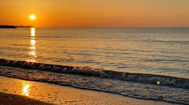 empty beaches at sunrise orange sky calm can