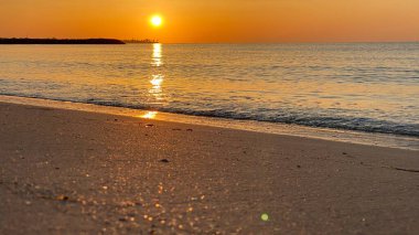 empty beaches at sunrise orange sky calm can