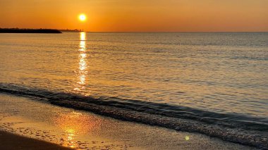 empty beaches at sunrise orange sky calm can