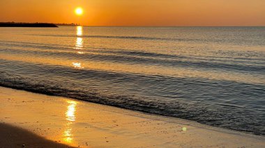 empty beaches at sunrise orange sky calm can