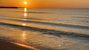 empty beaches at sunrise orange sky calm can