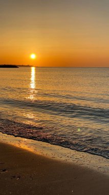 empty beaches at sunrise orange sky calm can