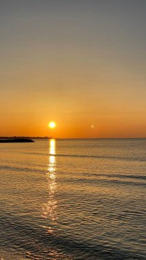 empty beaches at sunrise orange sky calm can