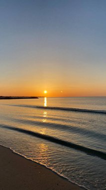 empty beaches at sunrise orange sky calm can