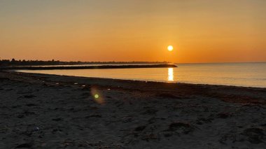 empty beaches at sunrise orange sky calm can