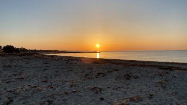 empty beaches at sunrise orange sky calm can