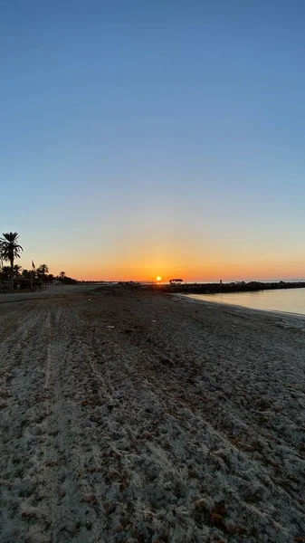 empty beaches at sunrise orange sky calm can