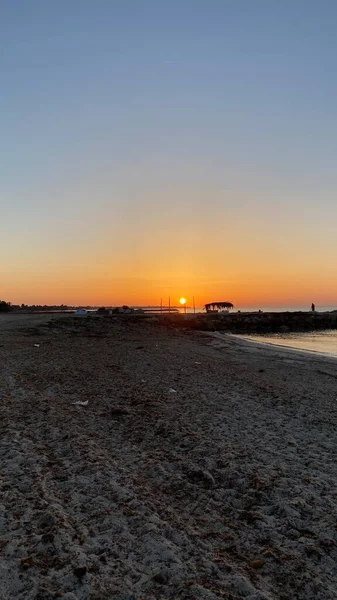 empty beaches at sunrise orange sky calm can