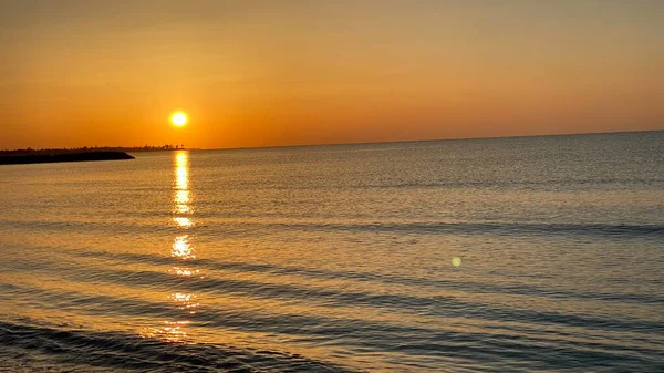 empty beaches at sunrise orange sky calm can