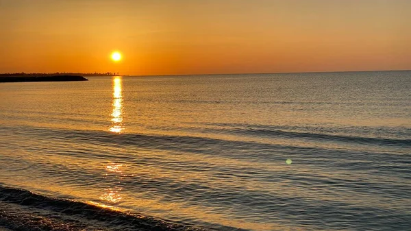 empty beaches at sunrise orange sky calm can