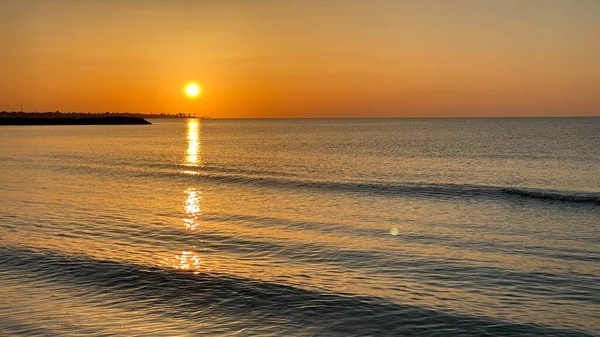 empty beaches at sunrise orange sky calm can