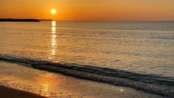 empty beaches at sunrise orange sky calm can