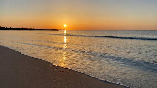 empty beaches at sunrise orange sky calm can