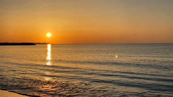 empty beaches at sunrise orange sky calm can