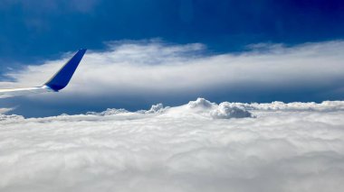 blue sky white billowing clouds arranged in various forms