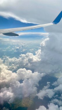 blue sky white billowing clouds arranged in various forms
