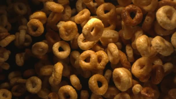 Honey Cereal Rings Flying Air Slow Motion Black Background — Video