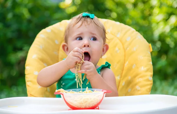 Baby Eats Spaghetti His Hands Selective Focus Kid — Stock Photo, Image